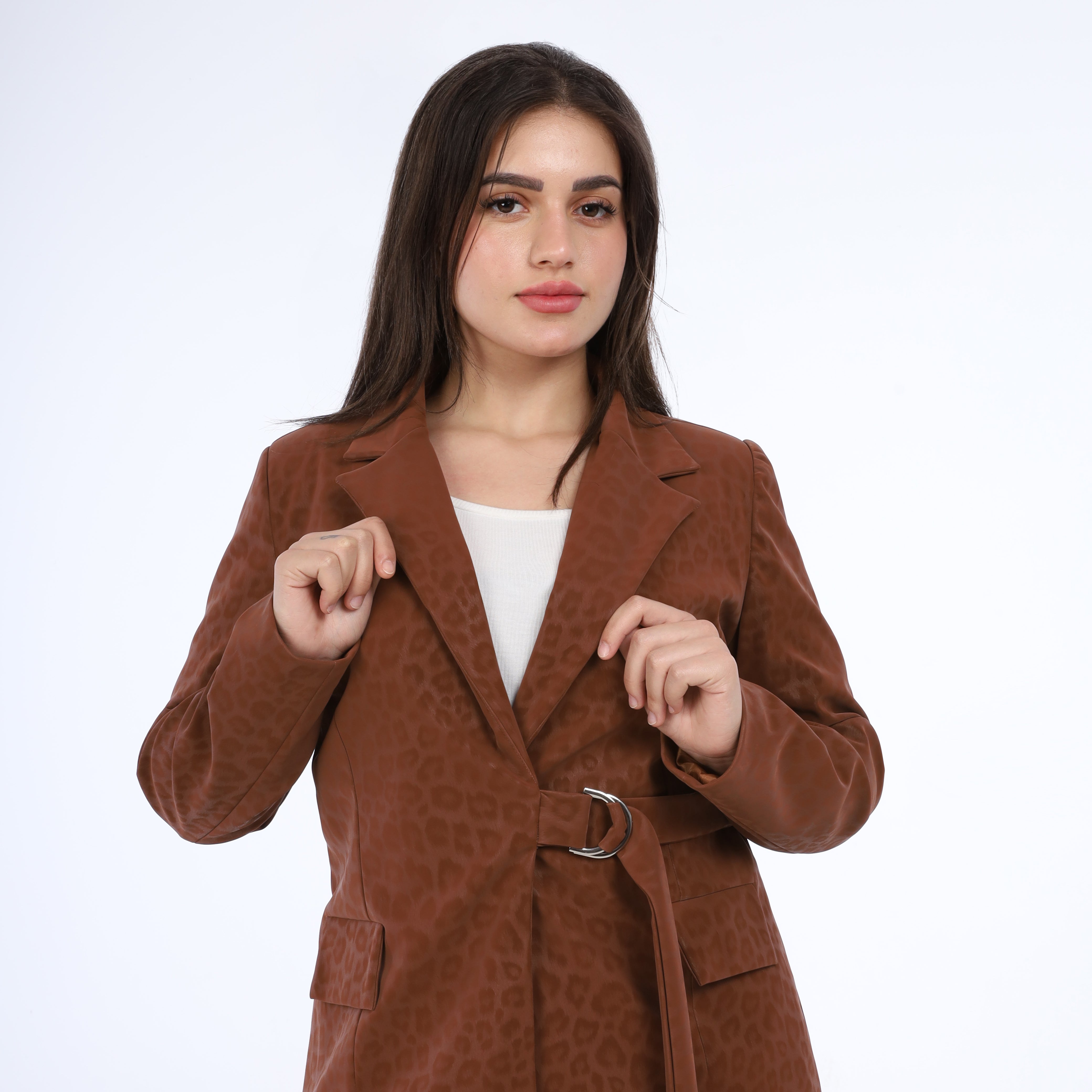 Woman wearing a brown textured coat on a white background