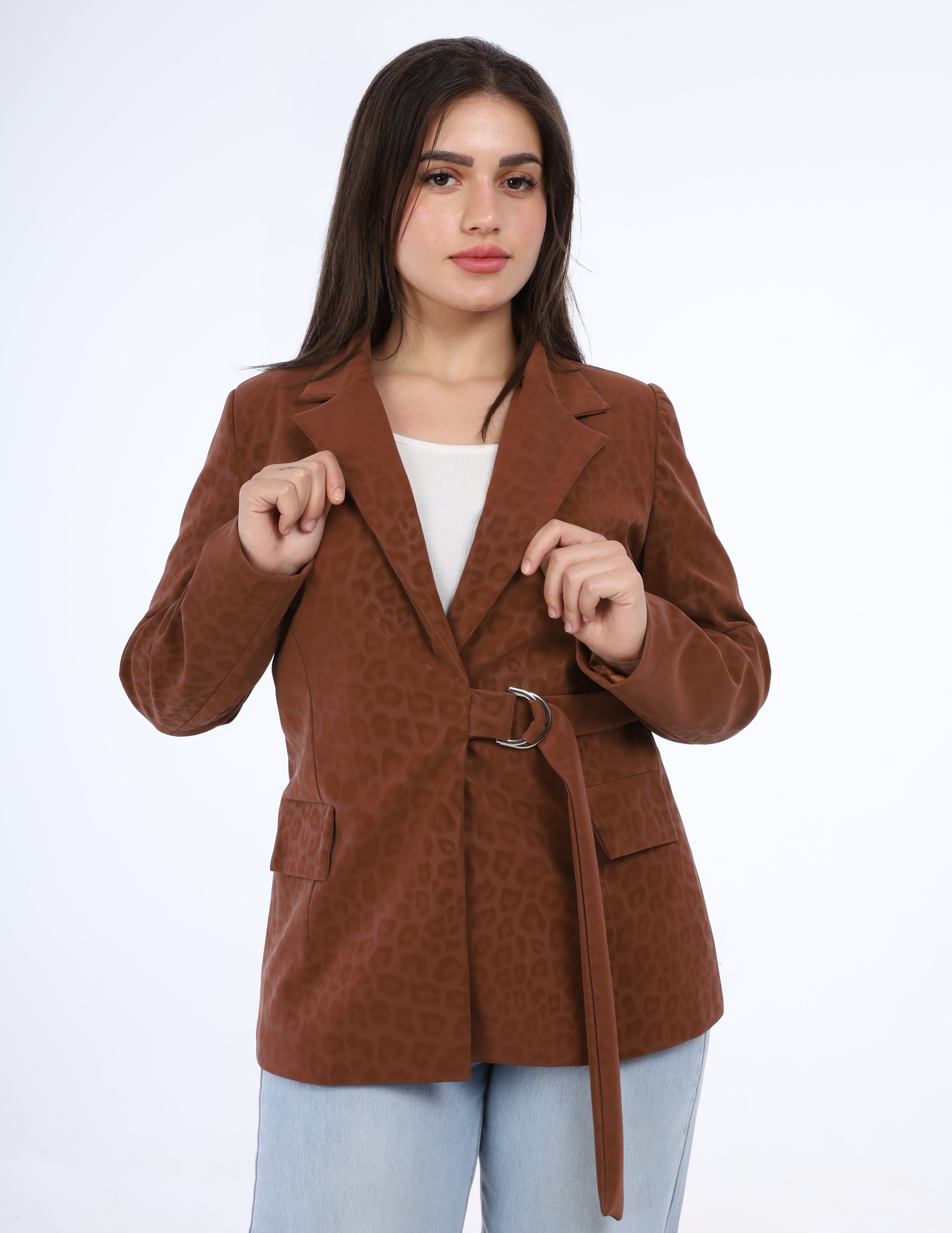 Woman wearing a brown textured coat on a white background