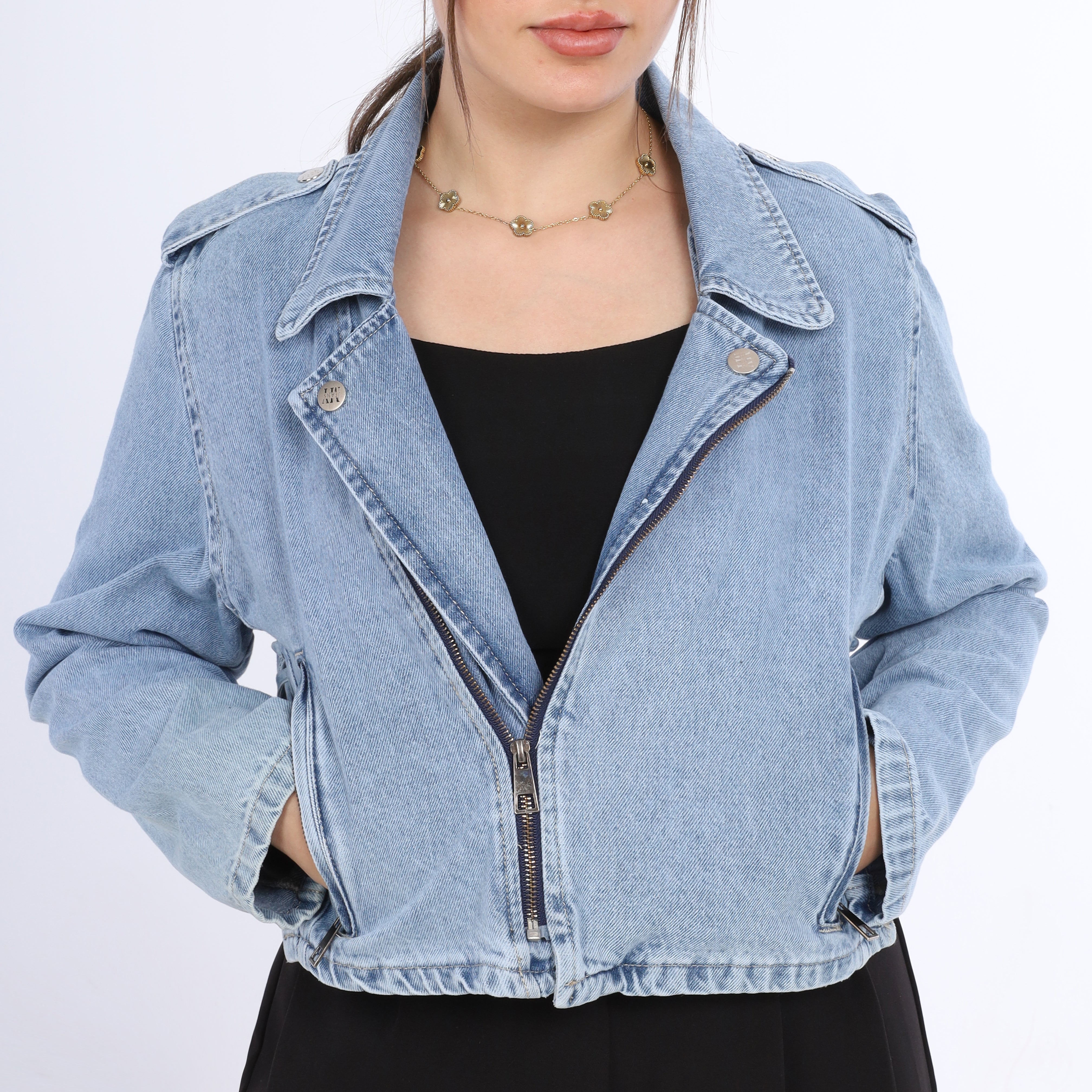 Denim jacket worn by a person on a white background
