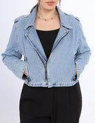 Denim jacket worn by a person on a white background